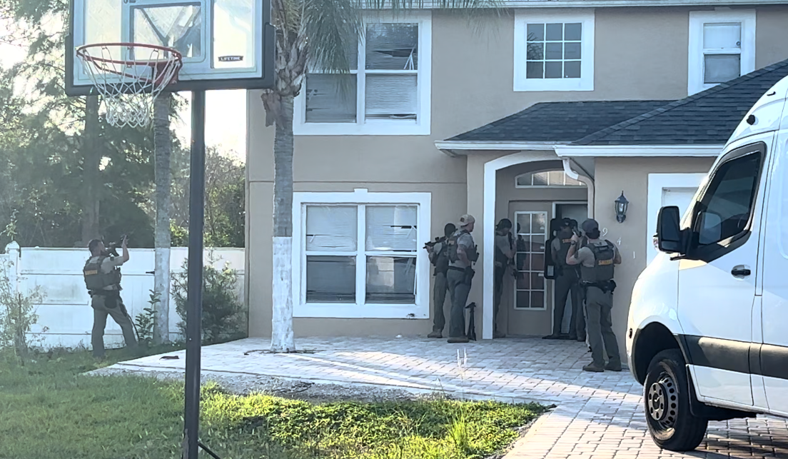 Osceola County SWAT members execute a search warrant at a home on Gillingham Court in Kissimmee June 17 as part of an investigation into a string of unlicensed, understaffed assistance living facilities in Osceola and Polk counties. (Photo/Osceola County Sheriff’s Office)