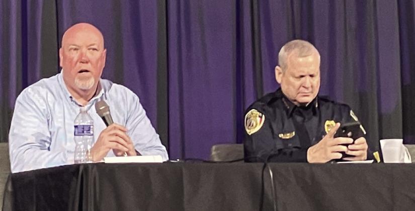 Kissimmee City Manager Mike Steigerwald (left) and retiring Kissimmee Police Chief Jeff O’Dell address public issues at last week’s downtown town hall meeting. PHOTO/DAVID CHIVERS