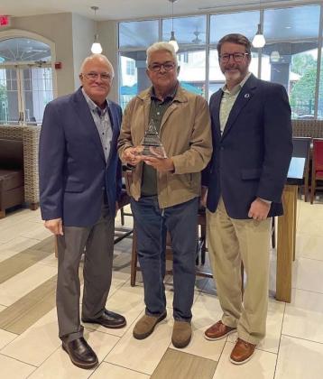 Nelson “Mr. Cappuccino” Mendez of RICO Foods a.k.a. Mr. Cappuccino (center) with The Osceola Chamber President/CEO John Newstreet (right) and Travel &amp;amp; Leisure Vice President, Global Supplier Diversity Jose Nido (left). PHOTO/THE OSCEOLA CHAMBER