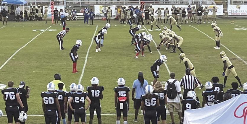 The Osceola Kowboys (at right, in gold) line up for a play against Rockledge Friday. The Kowboys knocked off the previously-undefeated Raiders, 30-7, behind three long David Buggs touchdown passes. PHOTO/ASHLEY BELLOMY