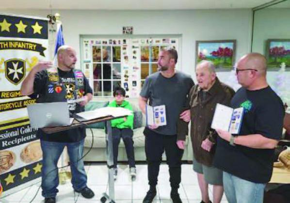 Rogelio Gonzalez Hernandez, flanked by his sons, Miguel and Rogelio, was awarded the Congressional Gold Medal by Hector Diaz, President and CEO of the 65th Infantry Regiment Motorcycle Club, on Nov. 20. SUBMITTED PHOTO
