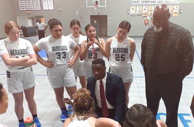 NEWS-GAZETTE PHOTO/J. DANIEL PEARSON Head Coach Dewrie Buggs talks to his City of Life team during a timeout of last Tuesday’s 70-30 Regional Semifinal win over Trinity Christian.
