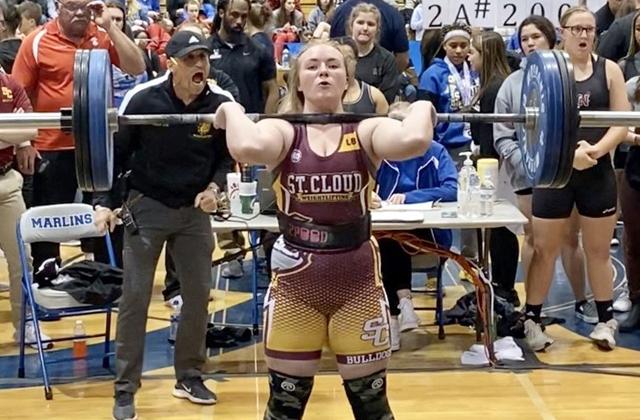 St. Cloud’s Hannah Wagner successfully lifts 180-pounds in the Clean and Jerk on her way to the 183-pound championship. PHOTO COURTESY OF CORY AUN/ST. CLOUD WEIGHTLIFTING