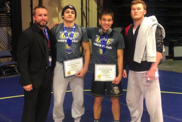 From left are: Head Coach CJ Cook, Clay Perry and UCF teammates Justin Trinh (national runner-up in the 141-pound weight class) and Jarrod Smiley (national runner-up in the 184-pound weight class).