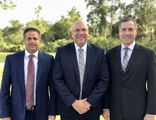 From left are Scott Sager, first counselor; Ryan Munns, stake president; and Clint Richardson, second counselor.