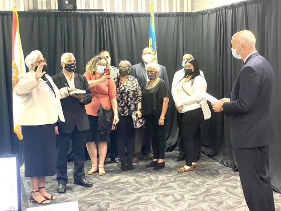 Kissimmee Mayor Olga Gonzales, far left, is sworn in. NEWS-GAZETTE PHOTO/BRIAN MCBRIDE
