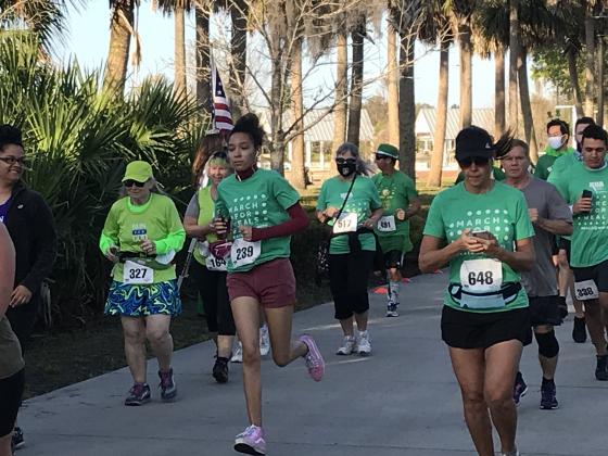 March for Meals 5K participants kick off the run &amp; walk at the Kissimmee lakefront.