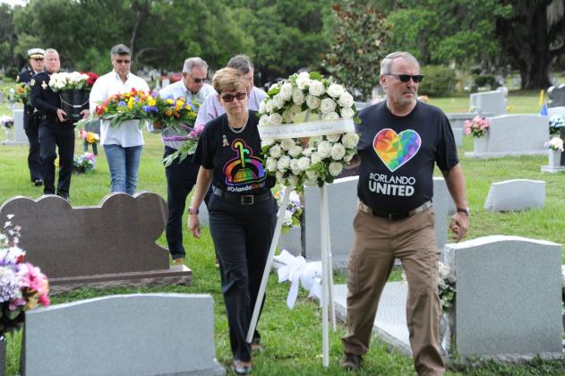 Orange County officials place wreaths on the graves of victims of the 2016 Pulse nightclub shooting in Orlando.