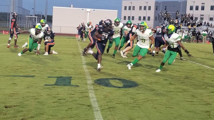 Tohopekaliga running back Kevin Chery runs around the right end in Friday's game against Lake Minneola. PHOTO/KEN JACKSON