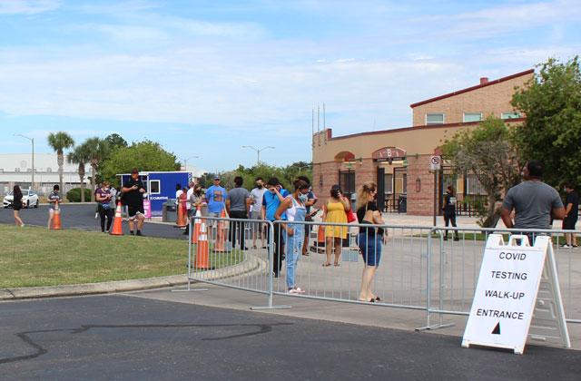 People line up to get tested at the COVID-19 site at Osceola County Stadium, which opened at 9 a.m. Monday. PHOTO/KEN JACKSON