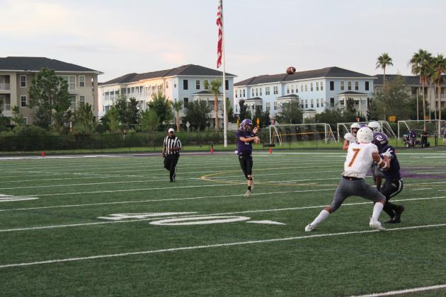 Dylan Davis, shown throwing a pass in Storm's Kickoff Classic, was 14-for-21 passing for 147 yards and three touchdowns against Poinciana Friday. PHOTO/KEN JACKSON