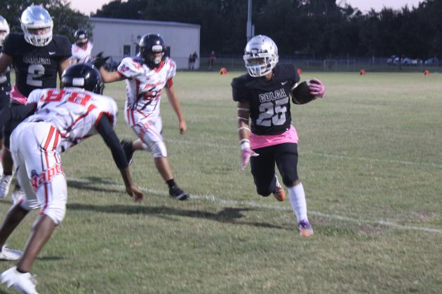 City of Life senior Anthony Felix picks up yards in a 52-14 win Friday over Real Life Christian. PHOTO/KEN JACKSON