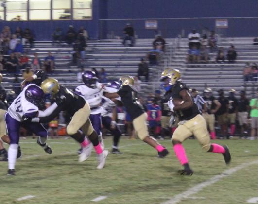 Osceola's Taevion Swint runs the ball in the Kowboys' 47-6 win over Celebration Saturday. PHOTO/KEN JACKSON