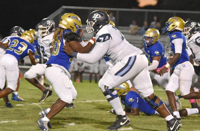 Osceola linebacker Joel Campbell gets the better of Dr. Phillips lineman Payton Kirkland, 140 pounds bigger, in Friday's 26-6 win. PHOTO/JANA STULTZ