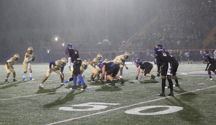 Osceola and West Orange play Friday's Region 8A-3 semifinal playoff game -- a 16-7 Warriors win -- mostly in a steady drizzle. PHOTO/KEN JACKSON