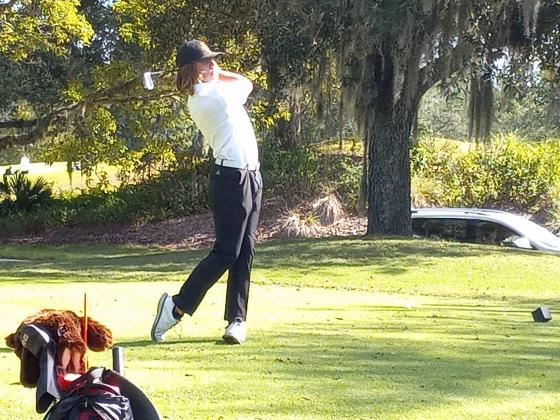 Alex Owen tees off on the 154-yard, Par 3 #12 at Orange Lake Legends course.  Owen struck the tee shot 15-feet left of the hole and made the birdie putt on his way to a seven-over 79.  PHOTO/DAN PEARSON