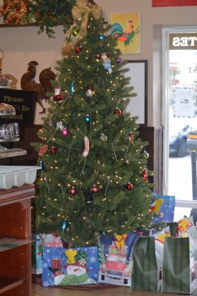 Hundreds of Woodsby's Countryside Cafe played the role of Christmas angels, providing presents to foster children. PHOTO/WADE KEEFER
