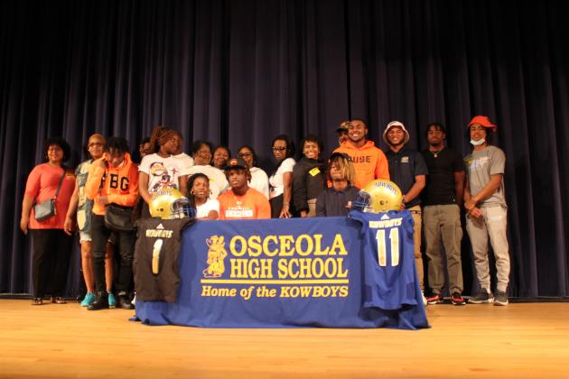 Chad Mascoe (seated left) and Jeremiah Wilson continued the tradition of Osceola Kowboys celebrating on National Signing Day, becoming a part of the 2022 classes for Campbell and Syracuse. PHOTO/KEN JACKSON