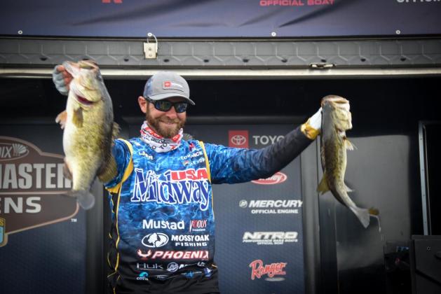 Brandon Lester, the pro division champion with two of his weekend catches.  PHOTO/CINDY JOINT