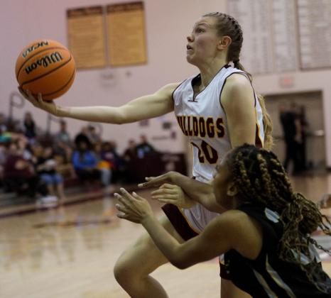 Lady Bulldogs' Emily Lockey drives in for two of her game-high 29 points in a 71-33 win over East Ridge. PHOTO/ROB HERBERT