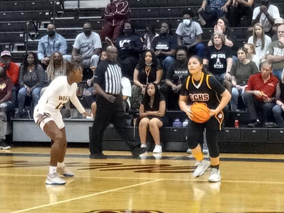 St. Cloud’s Danigzy Mantilla looks to pass against Wekiva’s Omaria Gordon.  Mantilla led St. Cloud in scoring with 10 points in the Bulldogs' 52-32 loss.