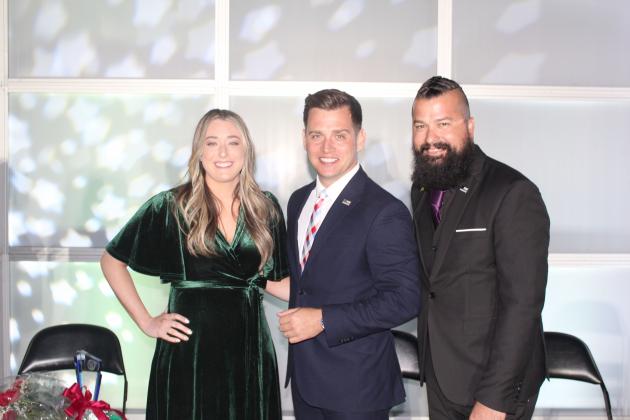 Teacher of the Year Taylor Kuwik and School-Related Employee of the Year Cody Workman pose with Education Awards ceremony and Poinciana High grad “Trooper Steve” Montiero (center) at Thursday’s banquet. PHOTO/KEN JACKSON