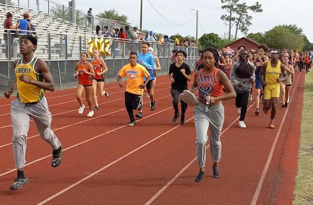 More than 350 athletes and coaches participating in the Orange Belt Conference Championships ran a ceremonial lap in honor of Stephanie Davis, a 2021 Tohopekaliga track and soccer star who died in a car accident over the weekend.  PHOTO/DAN PEARSON