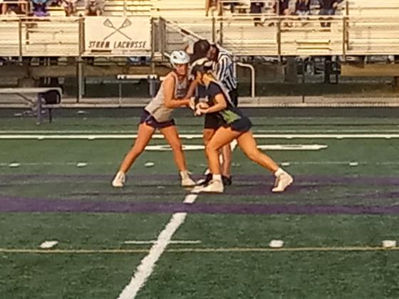 Celebration’s Abigael Locher (gray) squares off against Windermere’s Ashley Nelson at the start of the second half of Friday’s regional lacrosse game.  The Storm saw its season come to an end with a tough 16-15 loss. PHOTO/J.DANIEL PEARSON