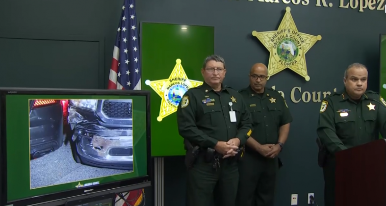 Osceola Sheriff Marcos Lopez shows pictures of deputy vehicles that got rammed during the April 27 incident at a west Kissimmee Target.