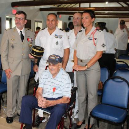Members of the French military, stationed in Tampa, congratulate Mr. Nemeth. PHOTO/TERRY LLOYD