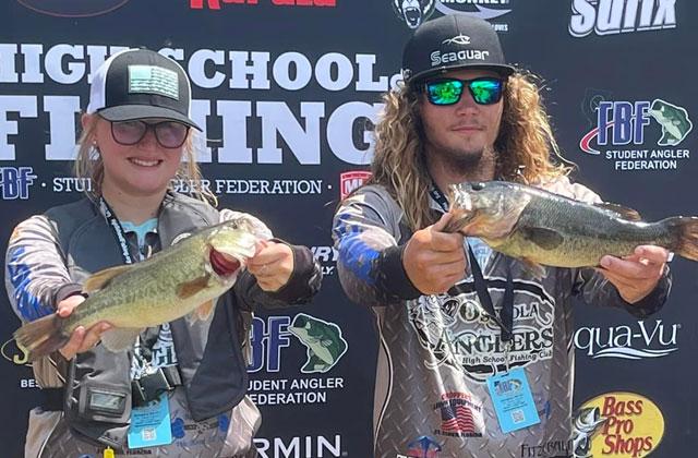 A couple members of the Osceola Anglers show off their catches at last month’s Student Angler Federation. PHOTO/OSCEOLA ANGLERS