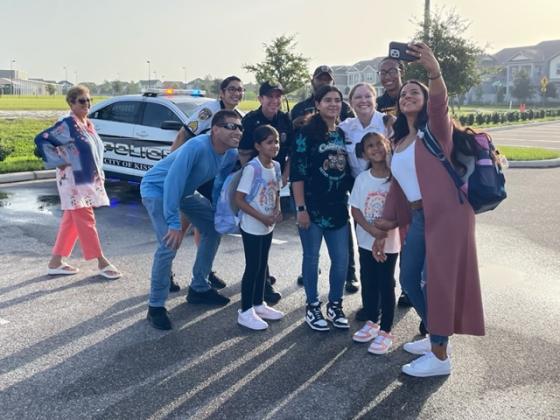 First day selfie: Sadia Baxter takes a selfie with daughters Sofia and Zarah, along with some law enforcement friends, Wednesday morning for Zarah's first day of school at Laureate Park Elementary School. PHOTO/LINDSEY TELLEZ