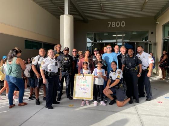 Zarah Baxter's first day of school Wednesday, surrounded by her law enforcement family, at Laureate Park Elementary School. PHOTO/LINDSEY TELLEZ