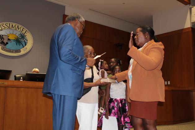 Angela Eady, joined by her family, takes her oath of office. PHOTO/KEN JACKSON