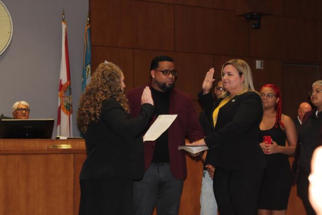 Janette Martinez, joined by her family, takes her oath of office. PHOTO/KEN JACKSON