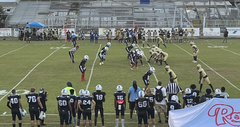 The Osceola Kowboys (right, in gold) line up to run a play against Rockledge Friday. QB David Buggs fired three long touchdown passes.