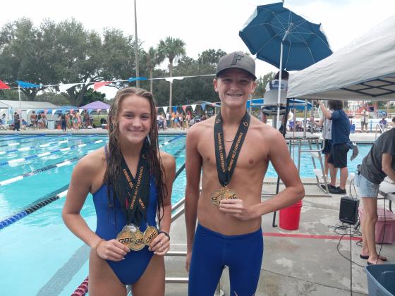 Harmony’s Sarina Steele and Eli Christ each won two individual events and competed on winning relay teams to help the Longhorns sweep the boys and girls Orange Belt Conference Swimming and Diving Championships. PHOTO/J. DANIEL PEARSON