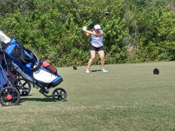 St. Cloud’s Tess Shieve tees off on number 18 at the FHSAA District 6 Championships.  After hitting her drive in the water, she would go on to make a sensational up-and-down par and shoot a career-low two-over 74 to help pace the Lady Bulldogs to a second place district finish and a trip to next week’s Class 3A, Region 2 Championship. PHOTO/J. DANIEL PEARSON