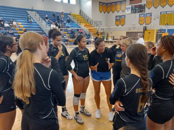 Osceola Coach Carrie Palmi tries to rally her team during a fifth set timeout.  Trailing 11-9 at the time, the Kowboys won the final six points in the set to defeat Jupiter for a spot in Wednesday’s Regional final. PHOTO/DAN PEARSON