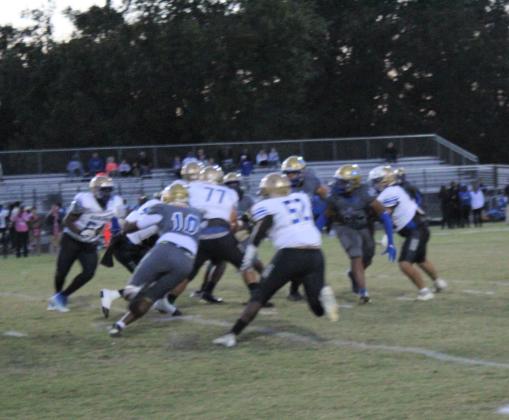 Osceola's Derrick LeBlanc (10) records one of his two sacks Friday on Mainland quarterback Demarcus Creecy. PHOTO/KEN JACKSON
