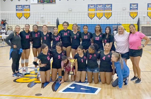 Osceola High with the OBC volleyball championship trophy after a three-set win over Tohopekaliga Thursday. PHOTO/DAN PEARSON