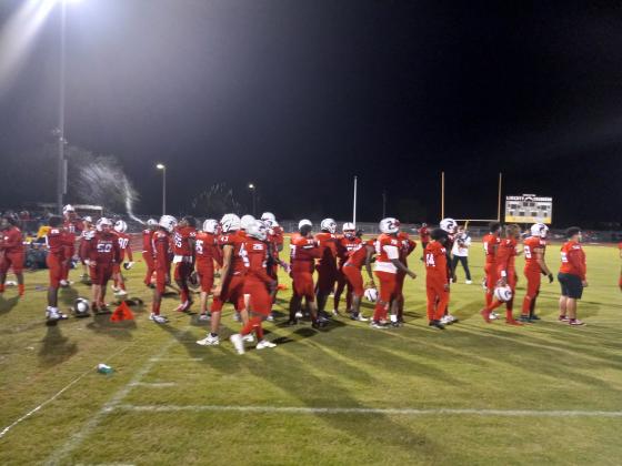 Poinciana players spray water when the final horn sounded in their win over Liberty.