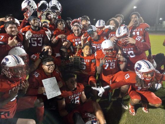 Poinciana players post with the Battle of the Boulevard trophy, taking the hardware home for the first time in school history.  (Photos by J. Daniel Pearson)