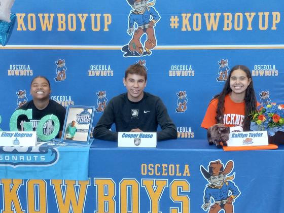 Osceola High's Eimy Negron, Cooper Haase and Kaitlyn Taylor sign college scholarships Wednesday.