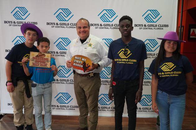 Sheriff Marcos Lopez "Saddled Up" with Boys &amp; Girls Club members. PHOTO/BOYS &amp; GIRLS CLUB