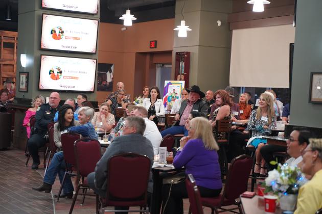 A big crowd in the Osceola Heritage Club listened to presentations at "Saddle Up" with Boys &amp; Girls Club members. PHOTO/BOYS &amp; GIRLS CLUB