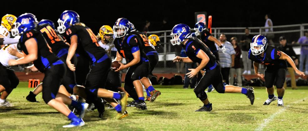 Harmony quarterback Aiden Parks (7) takes a snap during Friday's 44-0 Soldier City Classic victory. PHOTO/KATIE WILLIAMS