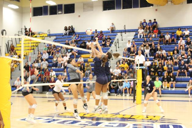 Osceola's Ahnika Johnson sends a ball back through Dr. Phillips' front line in Wednesday's straight-set win over the Panthers. The win puts the Kowboys into the Class 7A state semifinal for the first time. PHOTO/KEN JACKSON
