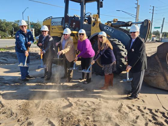 At Thursday’s BankFlorida groundbreaking in St. Cloud: state Rep. Fred Hawkins, St. Cloud Mayor Nathan Blackwell, BankFlorida Market President Tom White, St. Cloud Operations Manager Kit Shirah, BankFlorida Vice President Lori Giambrone, St. Cloud Chamber of Commerce President Dirk Webb. PHOTO/KEN JACKSON