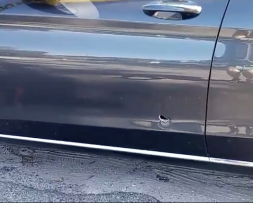 A bullet hole in a Mercedes sedan involved in a road rage shooting on Simpson Road north of Kissimmee. PHOTO VIA VIDEO/OSCEOLA COUNTY SHERIFF'S OFFICE